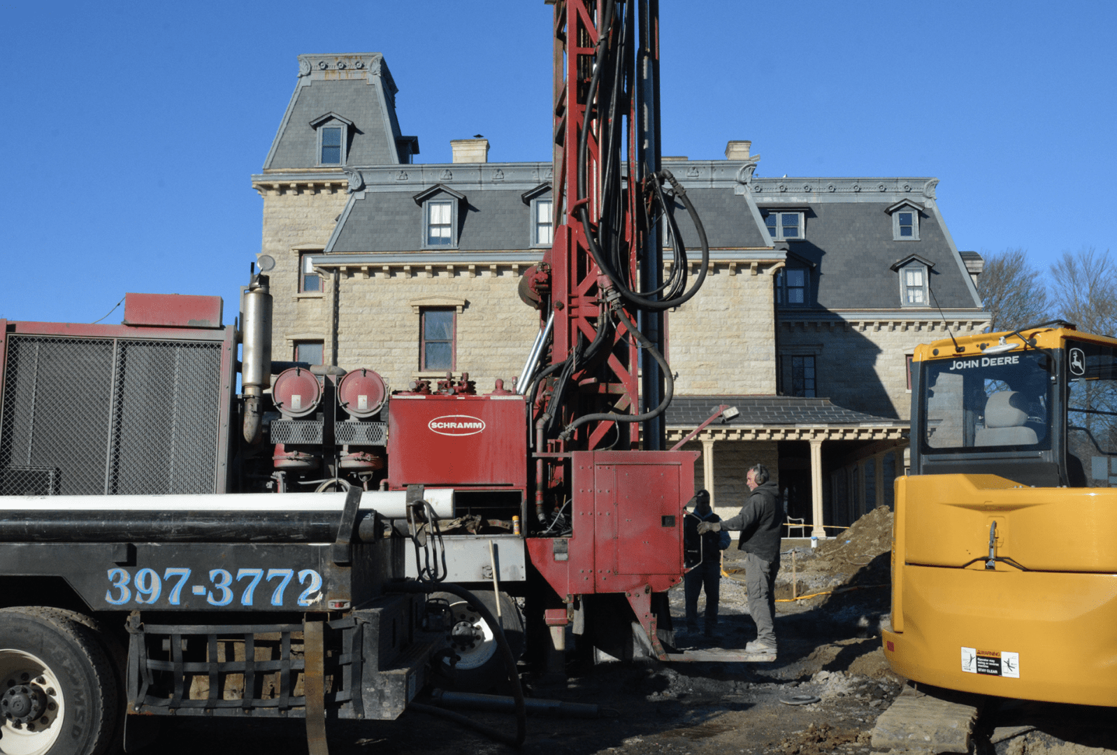 A yellow truck with a geothermal drill on it.