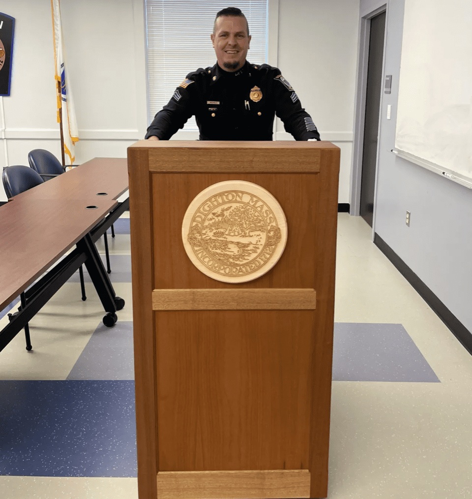 A Bristol Plymouth Regional Tech police officer standing in front of a podium.