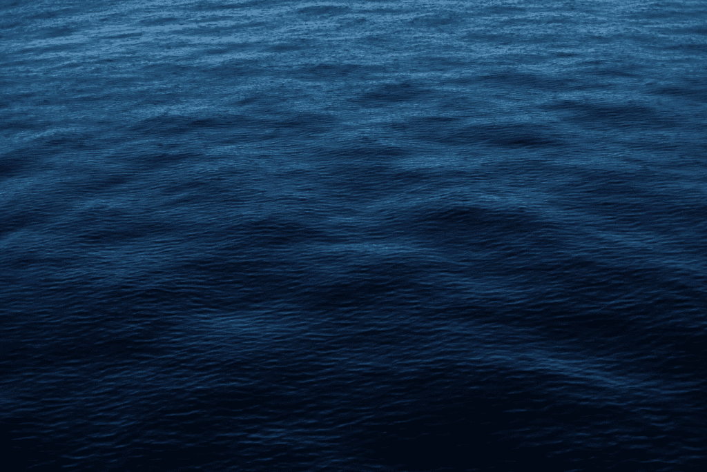 An image of a blue ocean with waves symbolizing grief.