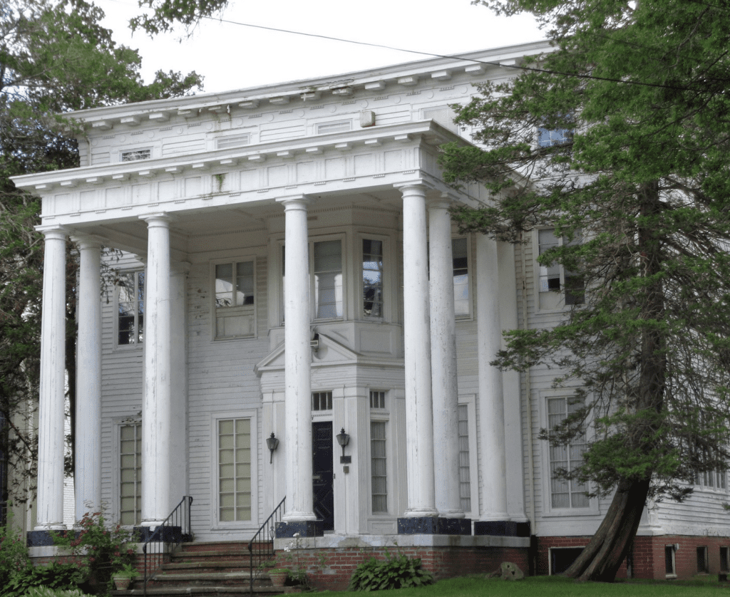A large white house with columns and pillars in Pawtucket.
