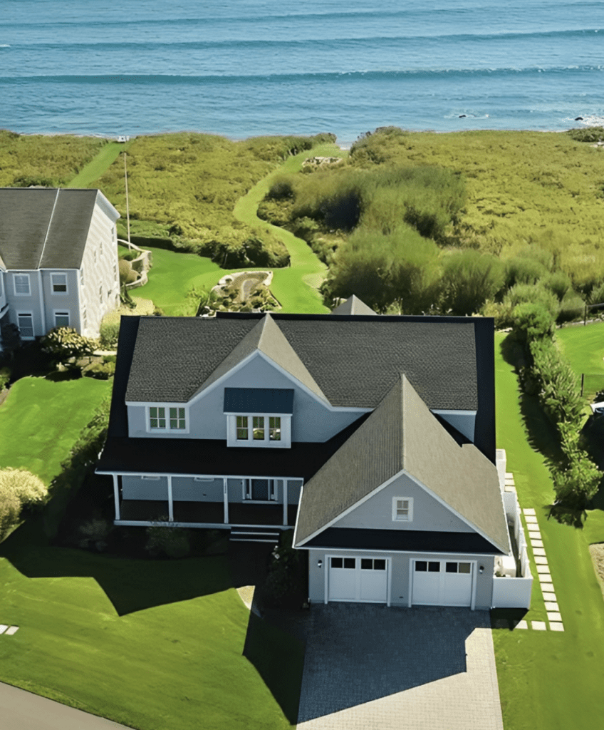 An aerial view of a Rhode Island home near the ocean.