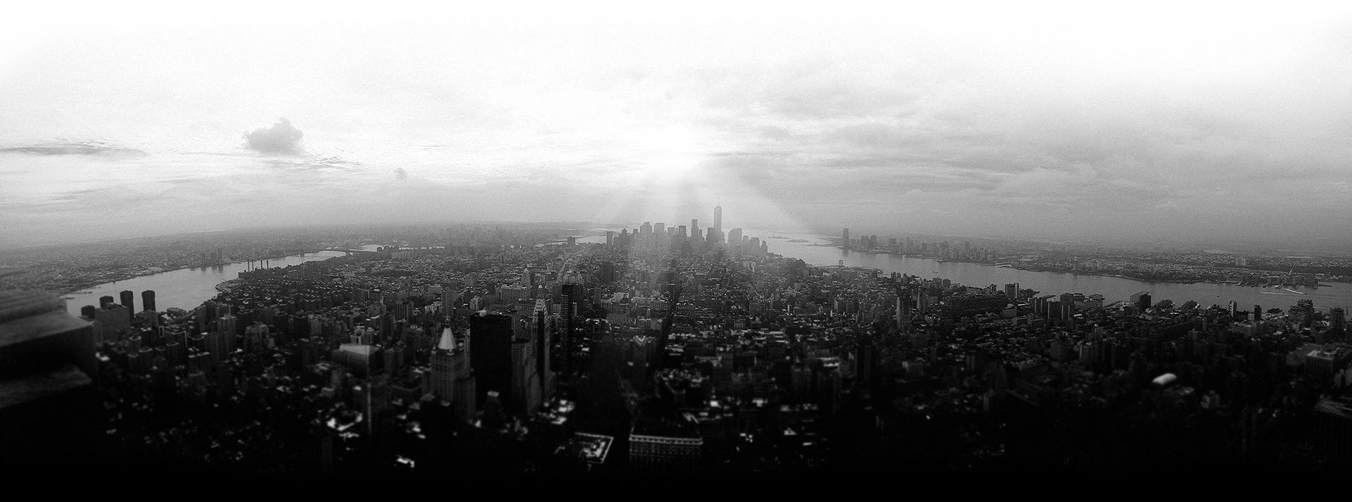A black and white photo of the skyline of new york city.