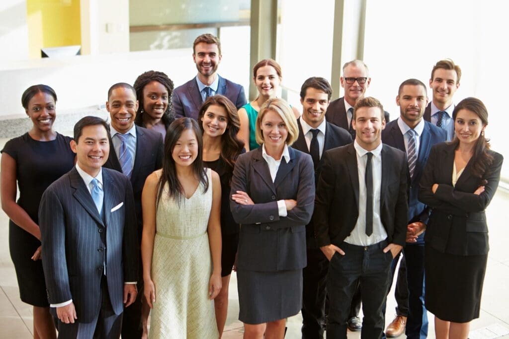 A group of business people posing for a photo.