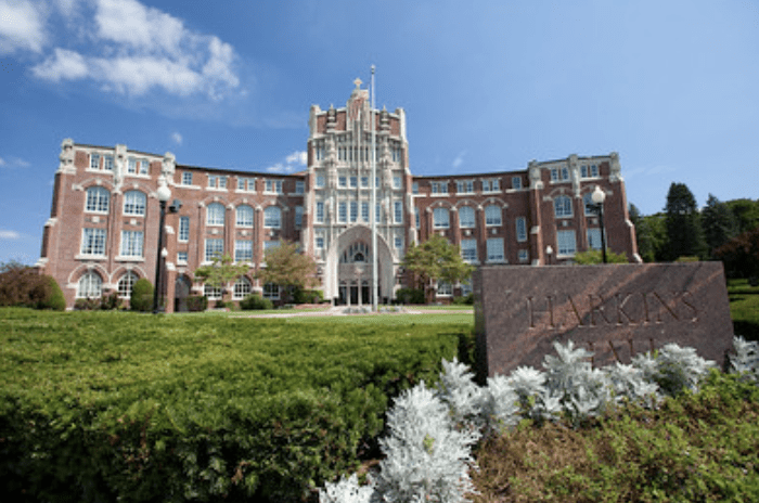 Harkins Hall, brick building, sunny day.