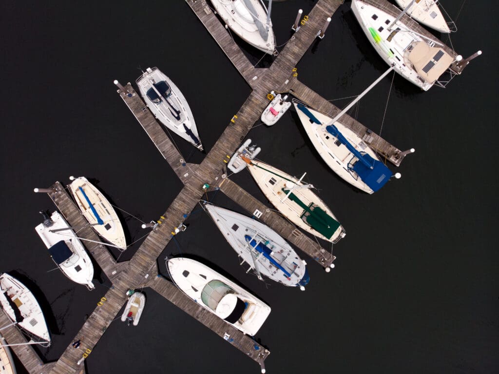 Aerial view of boats docked at marina.