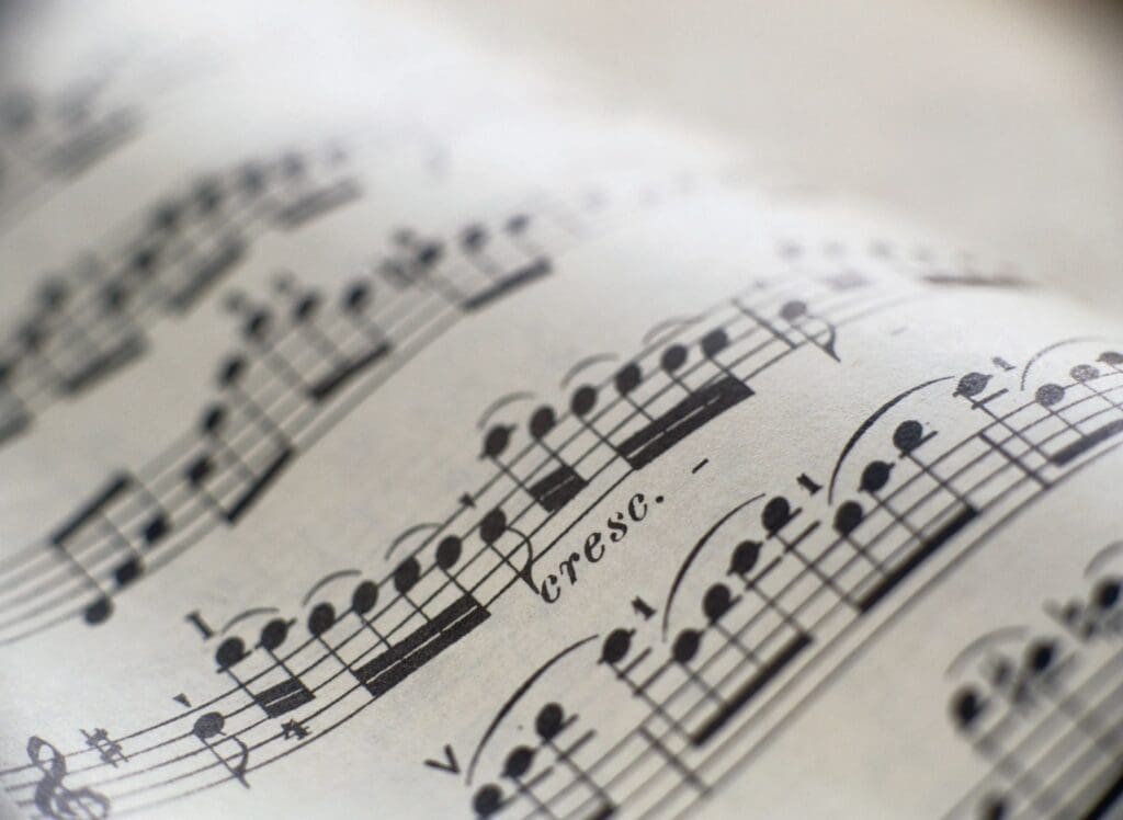Sheet music with crescendo markings.