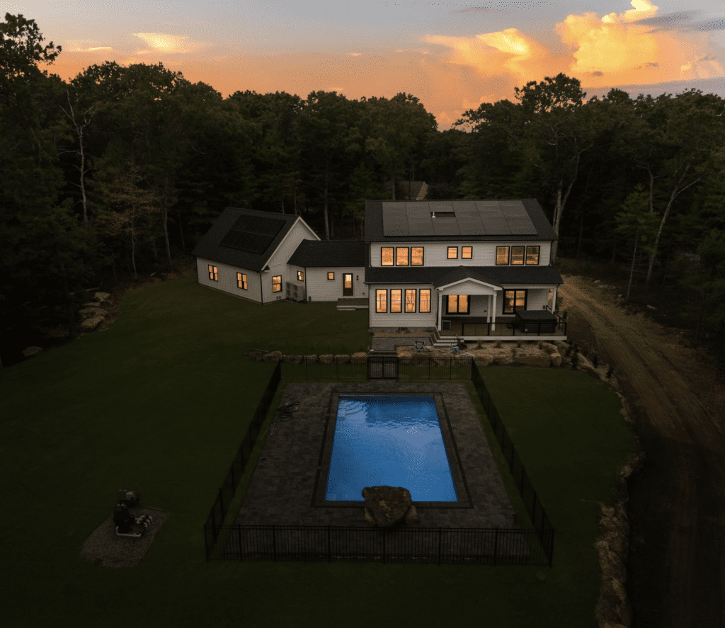 A house with a pool in the middle of it