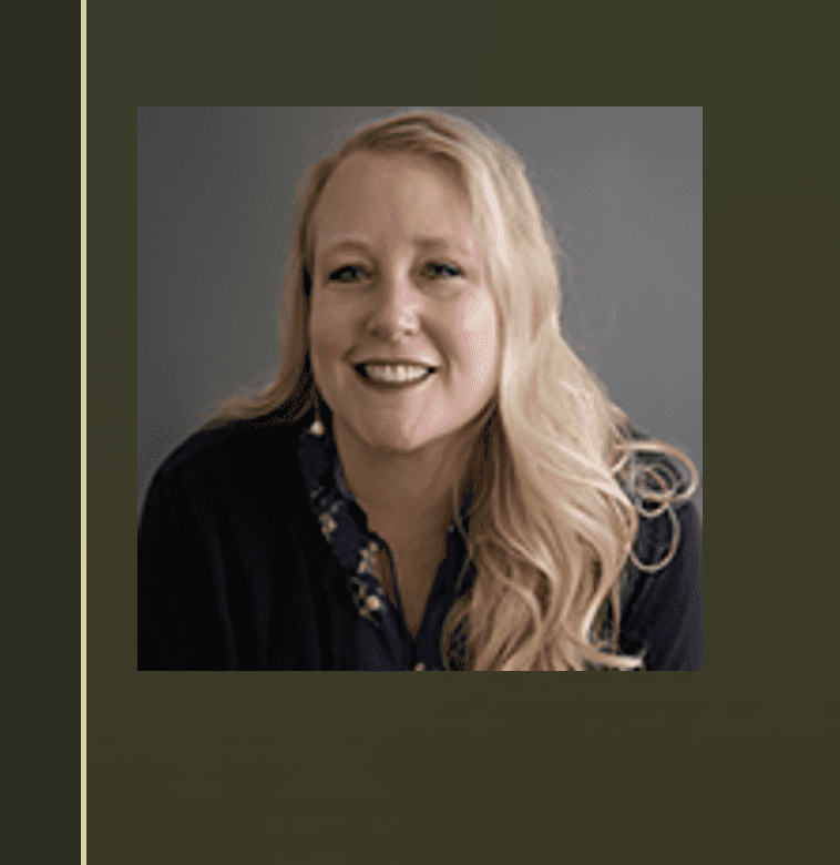 A woman with long blonde hair smiling for the camera.