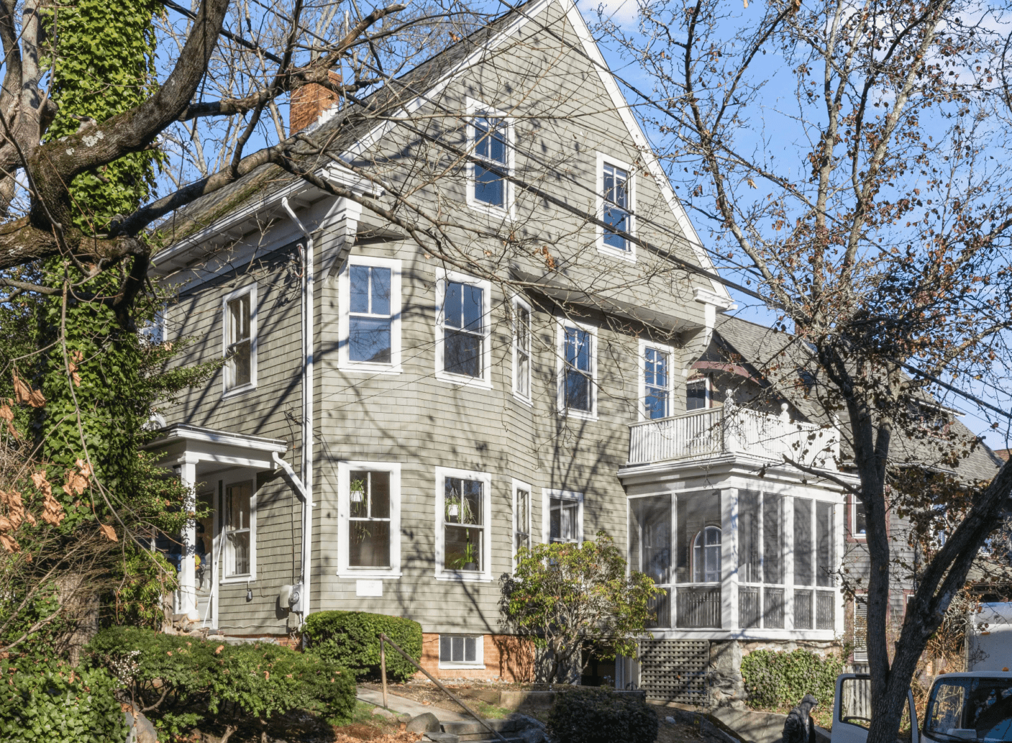 A large house with many windows and trees