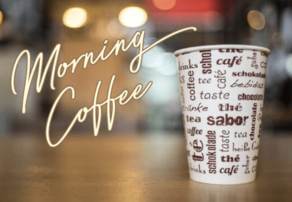 A coffee cup sitting on top of a table.