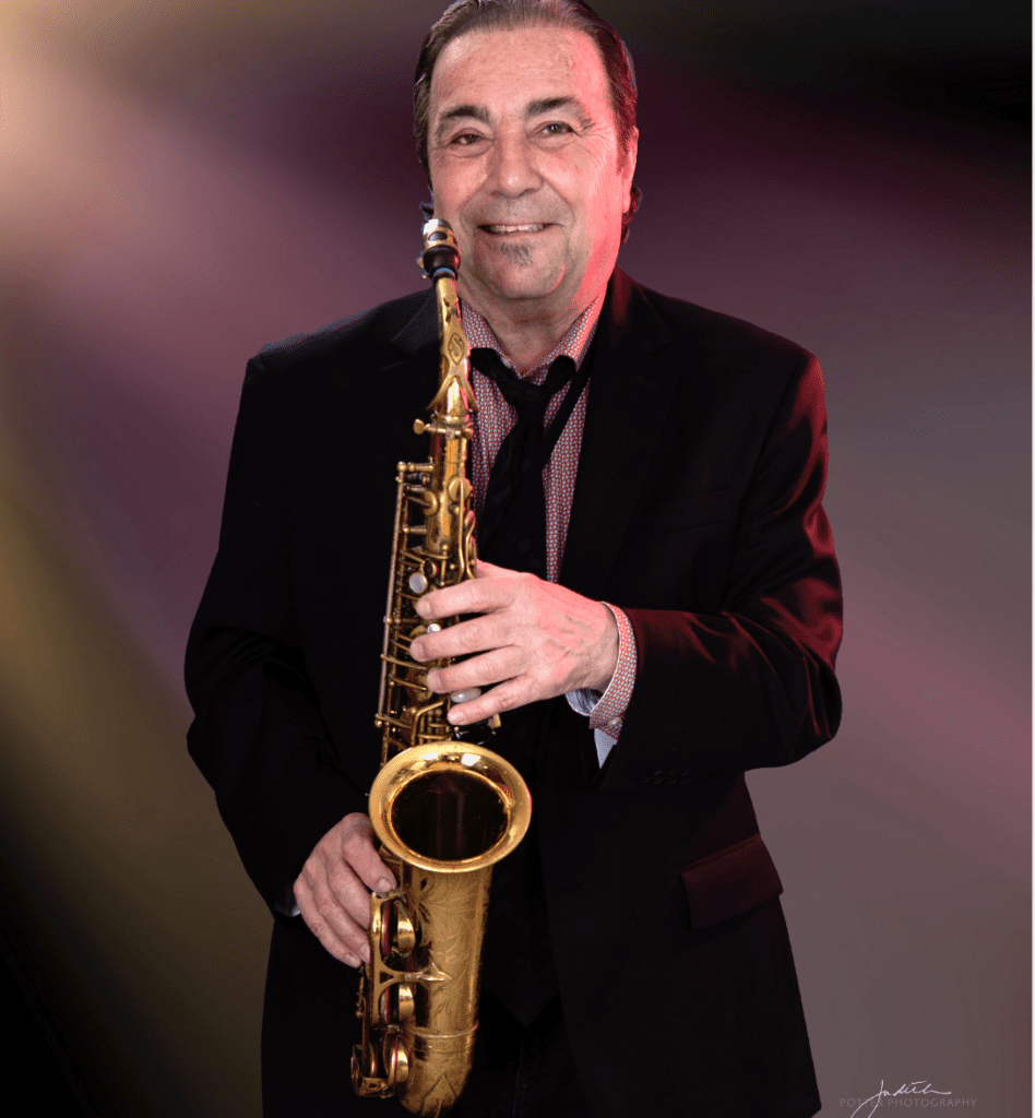 A man holding a saxophone in his hands.