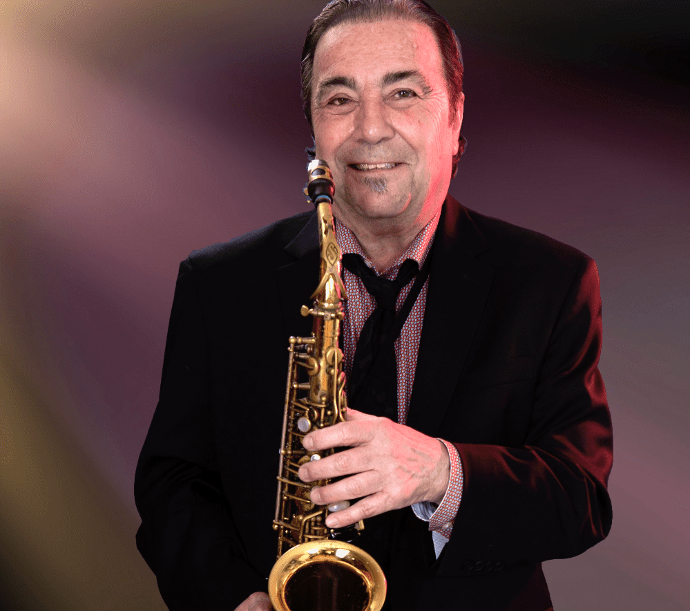 A man holding a saxophone in his hands.