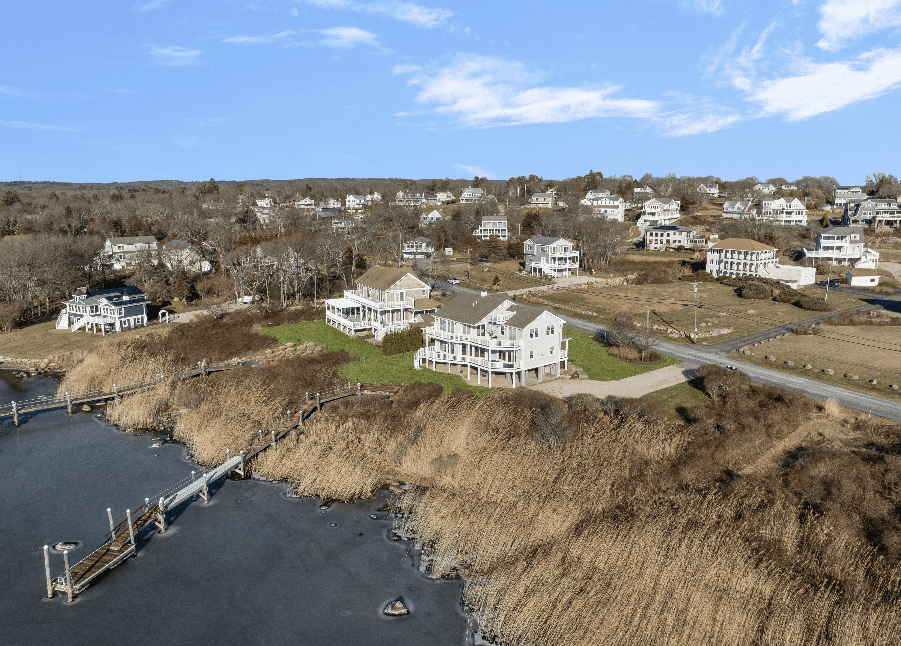 A bird 's eye view of houses and water.