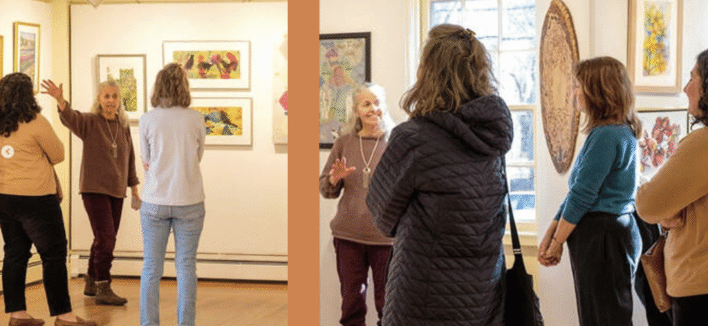 People observing art pieces in a gallery setting.