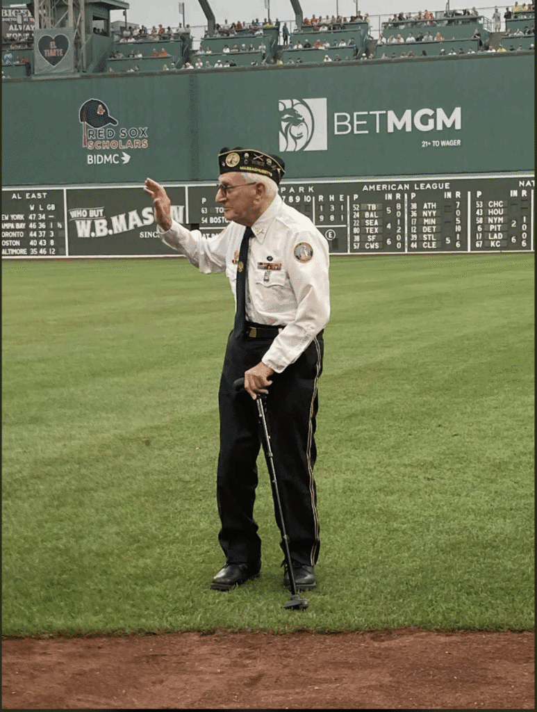 Security officer dancing on a baseball field during a game.