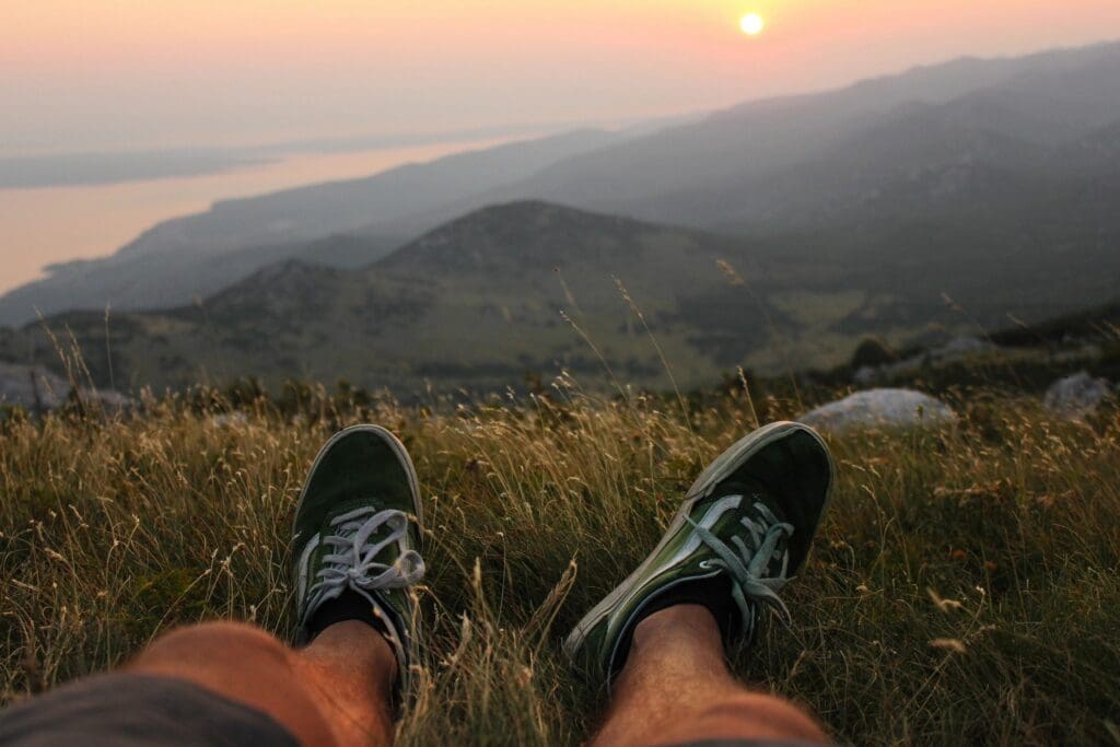 Relaxing at sunset with a scenic mountain view.
