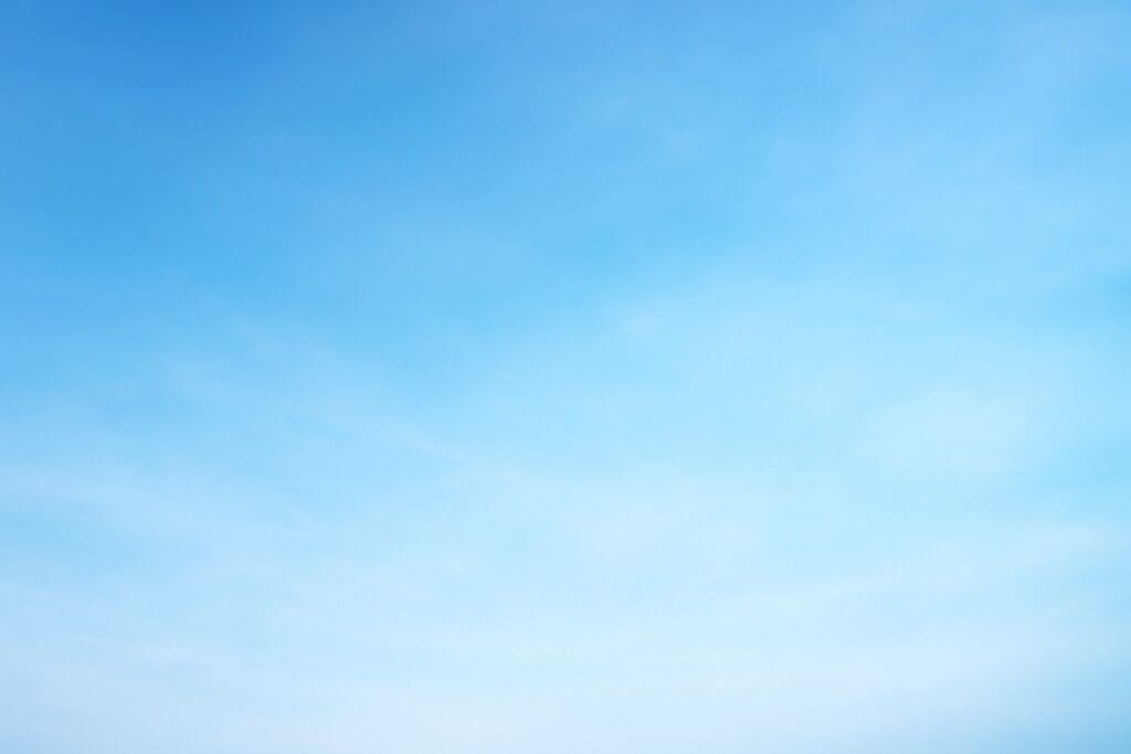 Clear blue sky with a few wispy clouds.