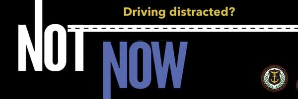 Driving distraction warning emphasizing 'NOW'.