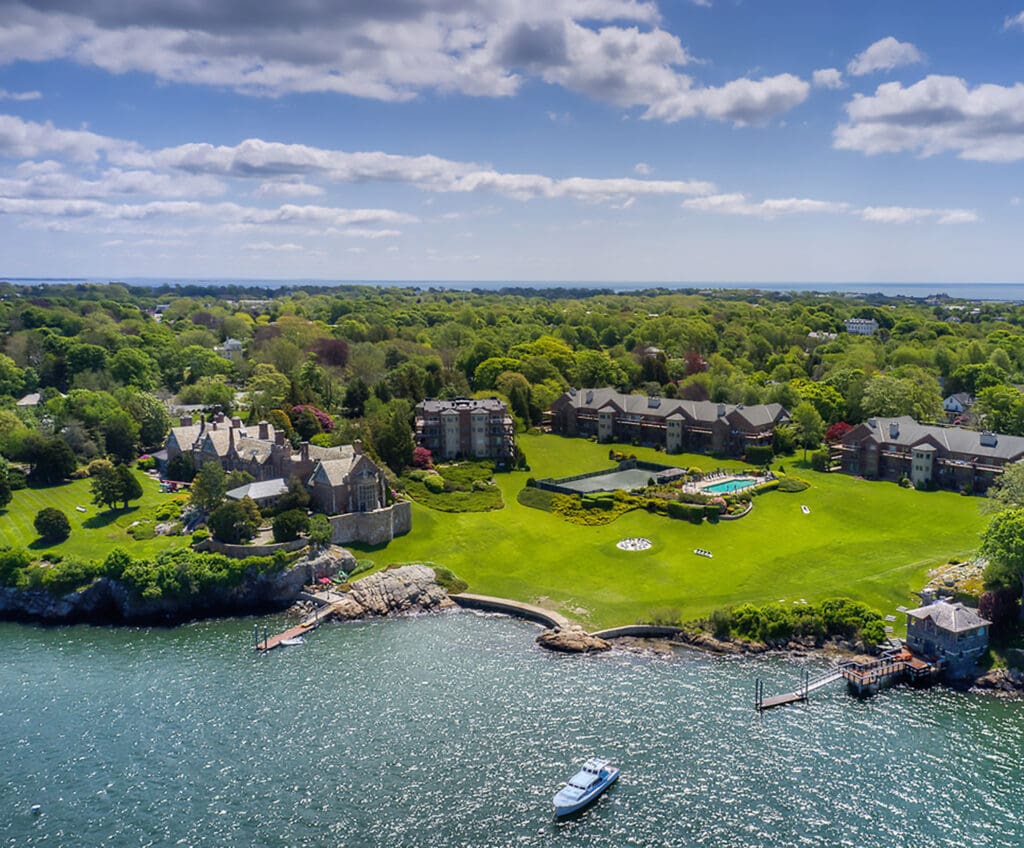 Scenic lakeside community with docks and lush greenery under a blue sky.