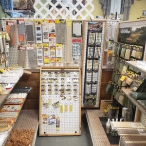 A craft supply store display filled with beads, charms, and jewelry-making materials.