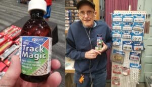 Elderly man proudly holding a bottle of 'Luck Magic' supplement in a store.