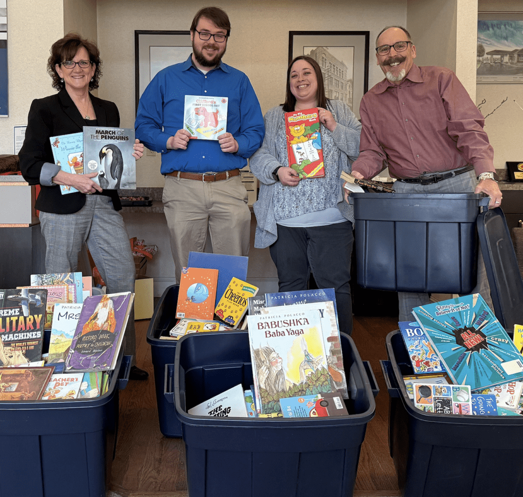 Book donation for Books are Wings - Beacon Bank