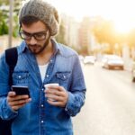 man on cell phone while traveling