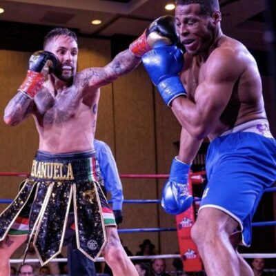Two boxers in action in a boxing ring.