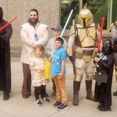 A group of people dressed up as star wars characters.