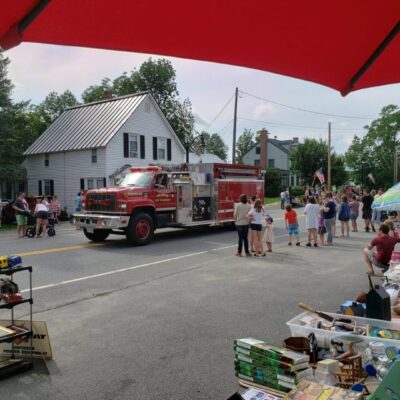 A fire truck driving down a street.