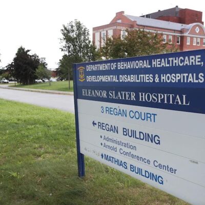 A sign in front of a building.