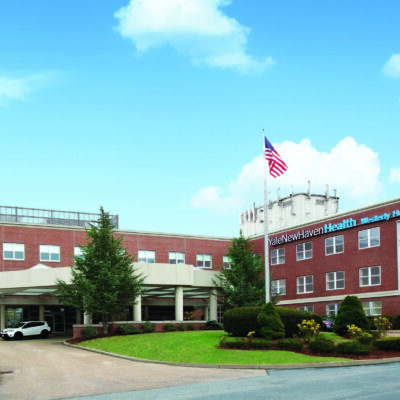 A brick building with a blue sky.