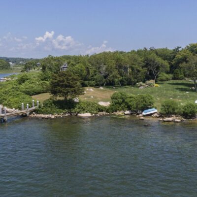 Waterfront home with docks and boats.