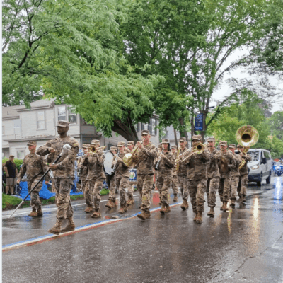 A group of veterans marching down a street.