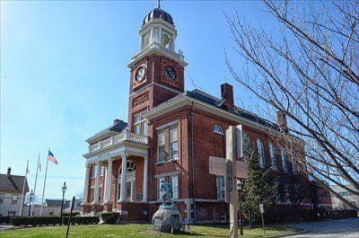 A large brick building with a clock tower.