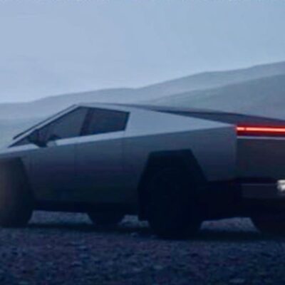 A car that is sitting in the dirt.