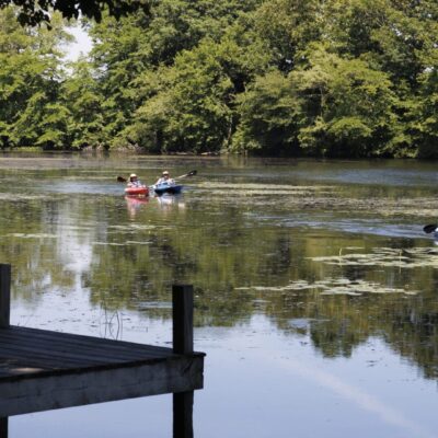 A group of people in canoes.