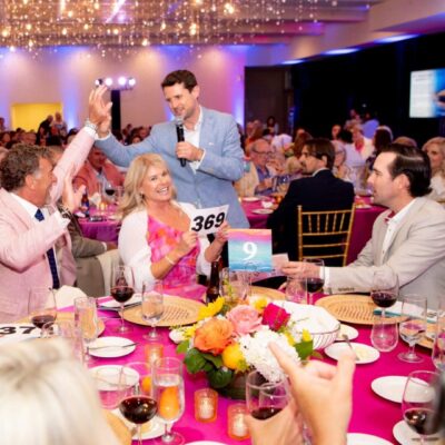 Auction winners celebrating at gala.