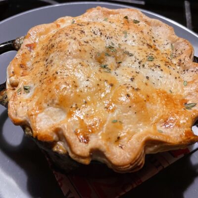 A pot pie sitting on top of a stove.