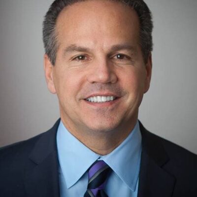 A man in a suit and tie smiling, Rep. Cicilline to become head of the Rhode Island Foundation.