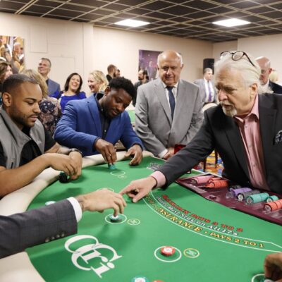 People playing blackjack at a casino event.