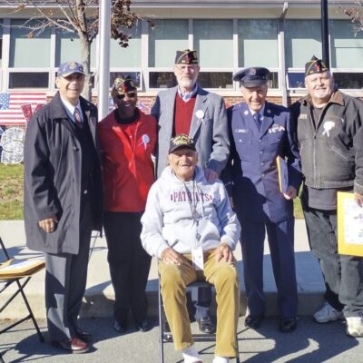 A group of veterans posing for a photo.