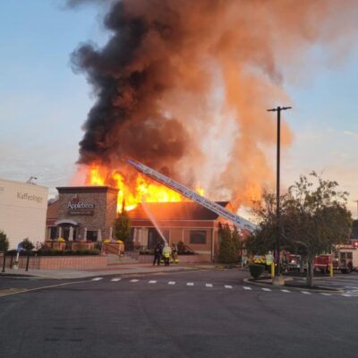 Applebee's restaurant engulfed in flames.