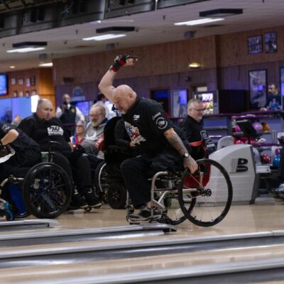 Wheelchair bowlers compete in a tournament.