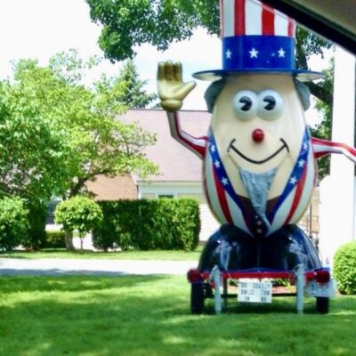 A statue of an american flag with an egg on it, showcased at the Bristol 4th of July Parade.