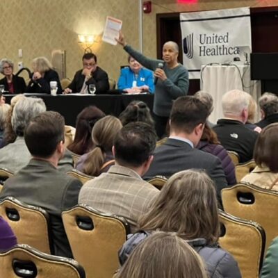 Woman presenting at United HealthCare event.