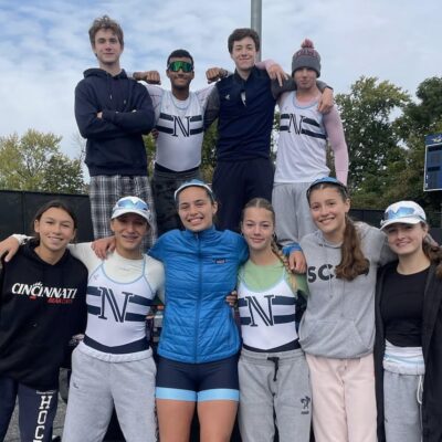 Members of Narragansett Boat Club posing for a picture on a tennis court.