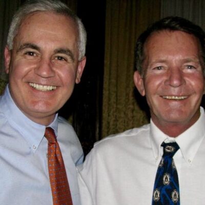 A man in a blue shirt.