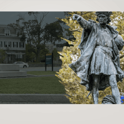 An image of a statue in front of a building.