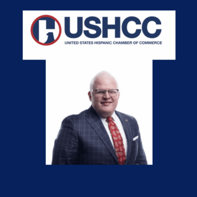 The ushc logo with a man in a suit and tie.